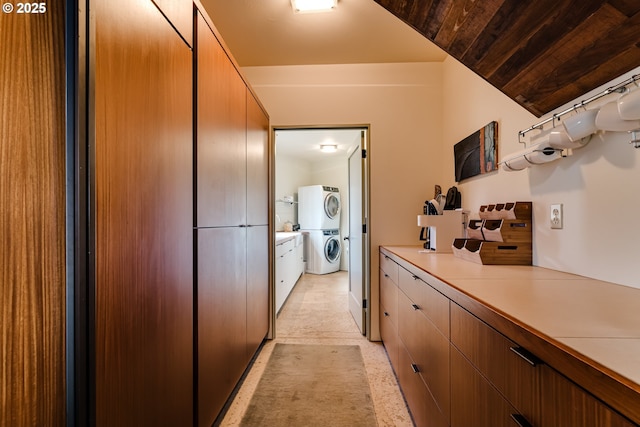 85789 Allbritain Ln, Eugene, OR 97405 - kitchen featuring stacked washer and clothes dryer and light countertops