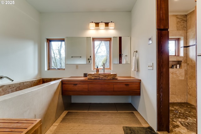 85789 Allbritain Ln, Eugene, OR 97405 - full bath with healthy amount of natural light, vanity, tiled shower, and tile patterned floors