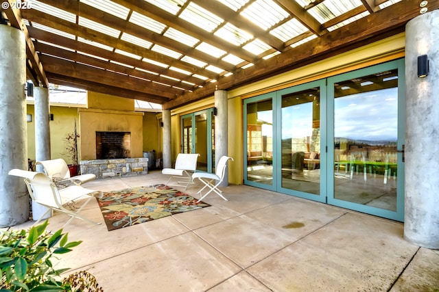 85789 Allbritain Ln, Eugene, OR 97405 - view of patio with an outdoor stone fireplace, french doors, and a pergola