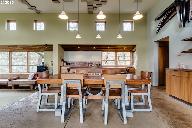 85789 Allbritain Ln, Eugene, OR 97405 - dining area featuring a towering ceiling and finished concrete flooring