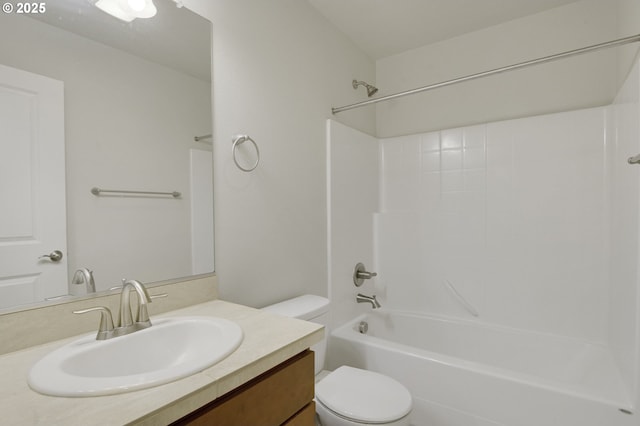 bathroom featuring toilet, vanity, and washtub / shower combination