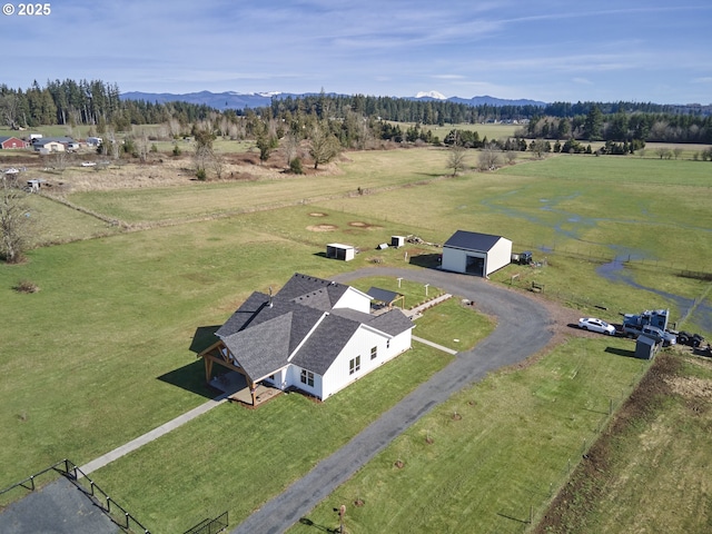 drone / aerial view featuring a rural view and a mountain view