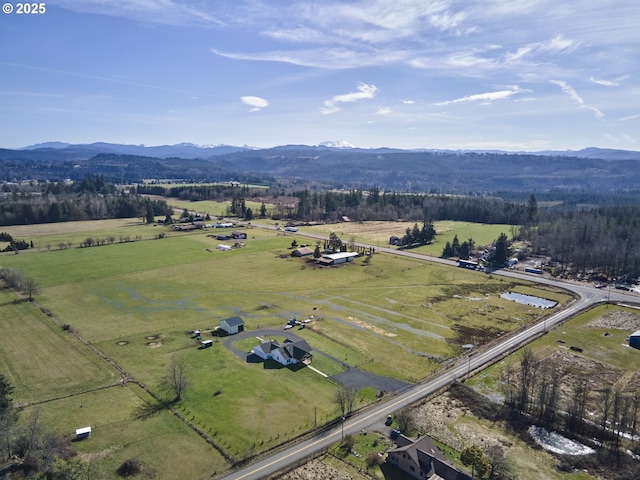 bird's eye view featuring a mountain view and a rural view