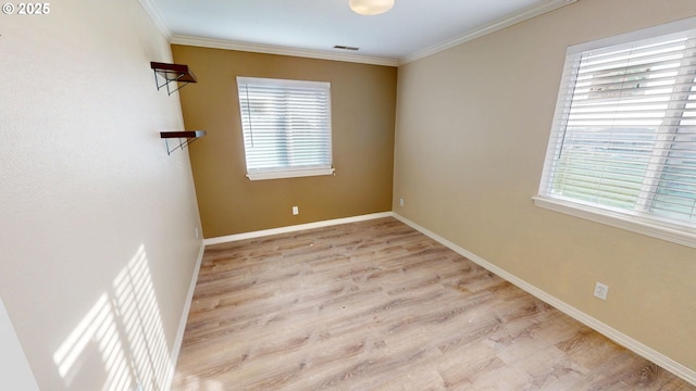 29847 Hillcrest St, Gold Beach, OR 97444 - empty room featuring plenty of natural light, wood finished floors, ornamental molding, and baseboards