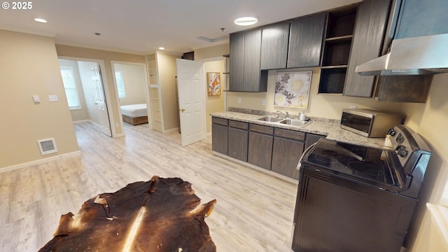 29847 Hillcrest St, Gold Beach, OR 97444 - kitchen with stainless steel microwave, electric stove, a sink, and light wood finished floors