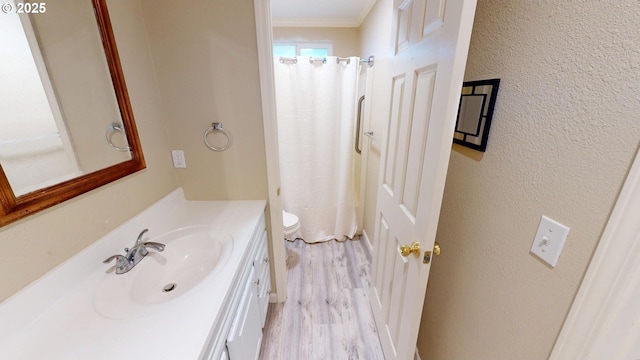 29847 Hillcrest St, Gold Beach, OR 97444 - full bathroom with vanity, wood finished floors, ornamental molding, and toilet