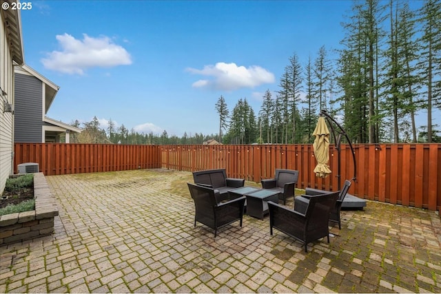 view of patio with cooling unit and a fenced backyard