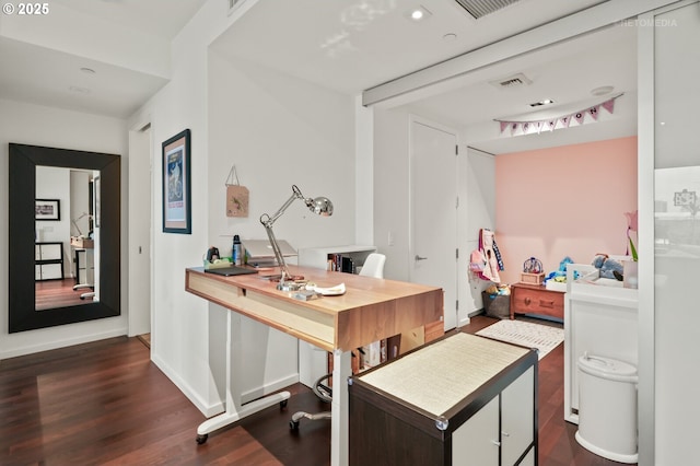 office area with dark wood-style flooring, visible vents, and baseboards