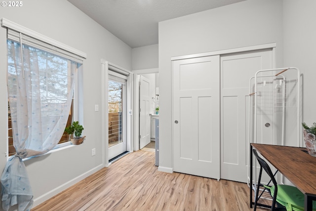 foyer entrance with light hardwood / wood-style floors