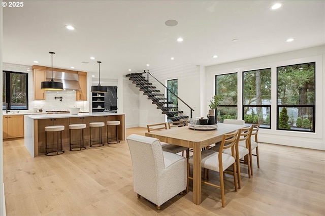 dining space with light hardwood / wood-style floors