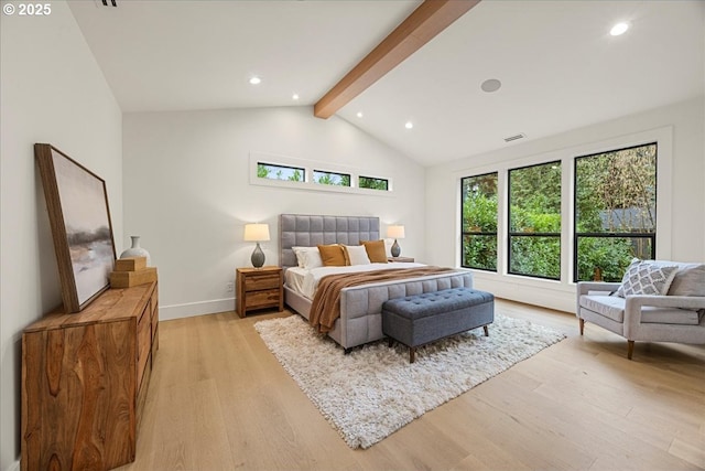 bedroom with light hardwood / wood-style flooring and lofted ceiling with beams