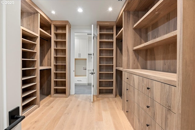 walk in closet featuring light wood-type flooring