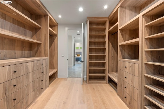 spacious closet with light wood-type flooring