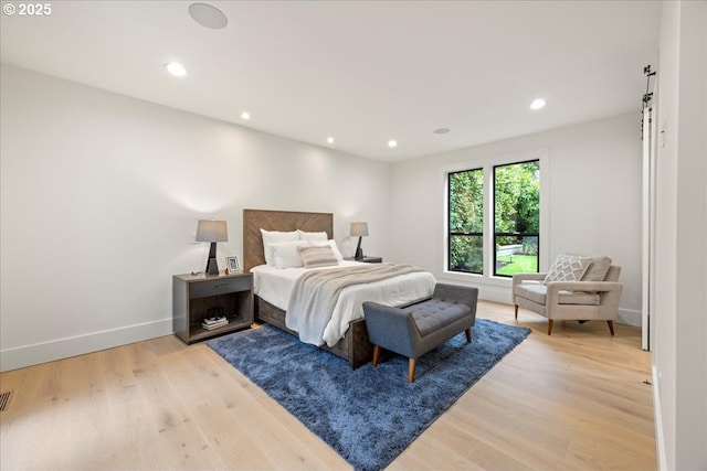 bedroom with light wood-type flooring