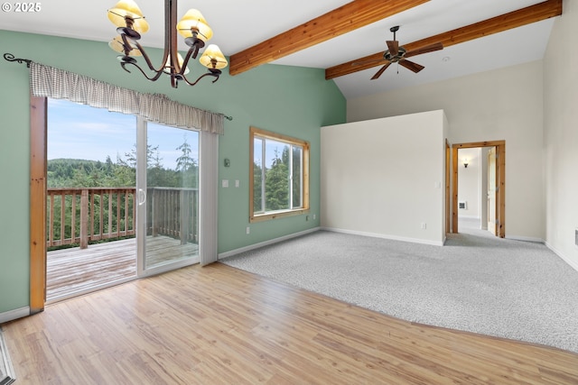 unfurnished room with a chandelier, baseboards, ceiling fan, and wood finished floors