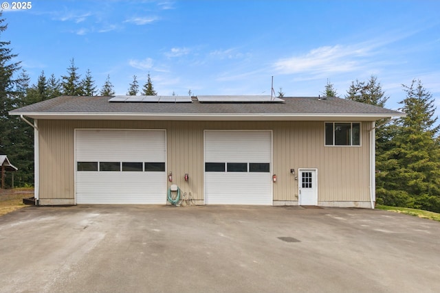 detached garage with roof mounted solar panels