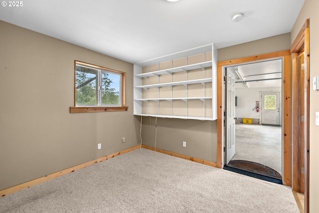 unfurnished bedroom featuring carpet flooring and baseboards