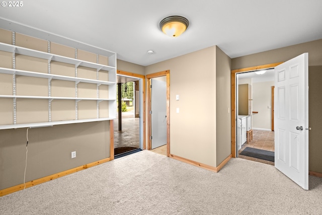 unfurnished bedroom with baseboards and carpet floors