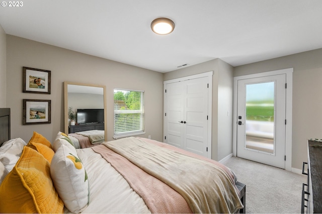 15915 SE Harold Ave, Milwaukie, OR 97267 - bedroom featuring light colored carpet, baseboards, a closet, and access to exterior