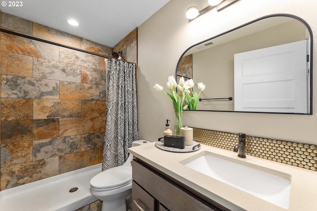 15915 SE Harold Ave, Milwaukie, OR 97267 - full bathroom featuring tiled shower, toilet, vanity, and decorative backsplash