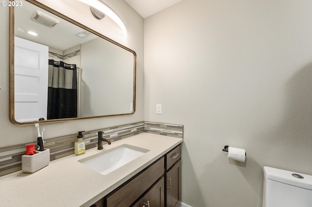 15915 SE Harold Ave, Milwaukie, OR 97267 - bathroom with tasteful backsplash, toilet, vanity, and baseboards