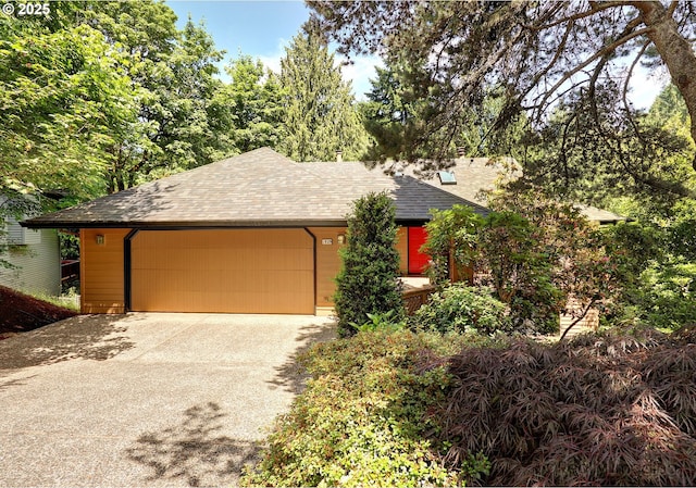 1929 SW Broadleaf Dr, Portland, OR 97219 - view of front of home with a shingled roof, driveway, and a garage