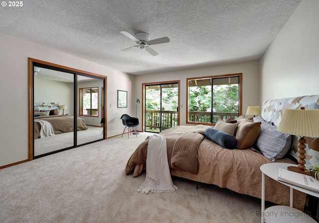 1929 SW Broadleaf Dr, Portland, OR 97219 - carpeted bedroom with access to exterior, multiple windows, a ceiling fan, a textured ceiling, and a closet