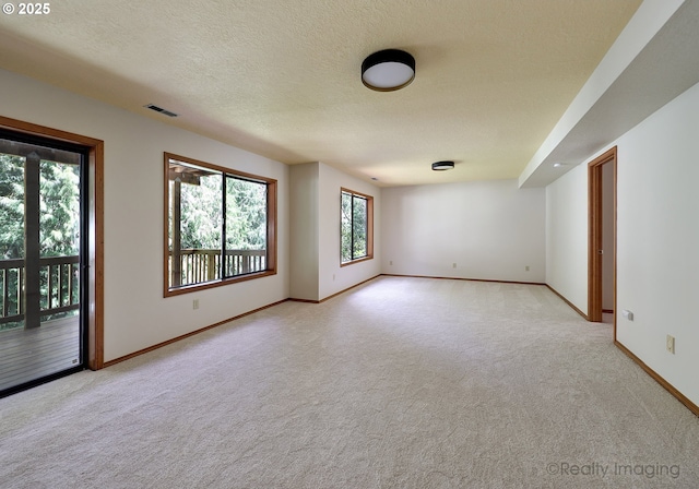 1929 SW Broadleaf Dr, Portland, OR 97219 - unfurnished room with light carpet and a textured ceiling