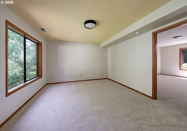 1929 SW Broadleaf Dr, Portland, OR 97219 - empty room with light colored carpet and a textured ceiling