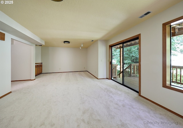 1929 SW Broadleaf Dr, Portland, OR 97219 - spare room featuring light carpet, healthy amount of natural light, and a textured ceiling