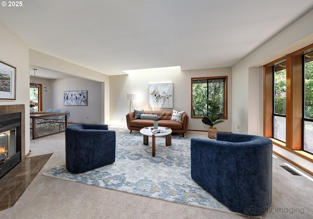 1929 SW Broadleaf Dr, Portland, OR 97219 - carpeted living room with a tiled fireplace