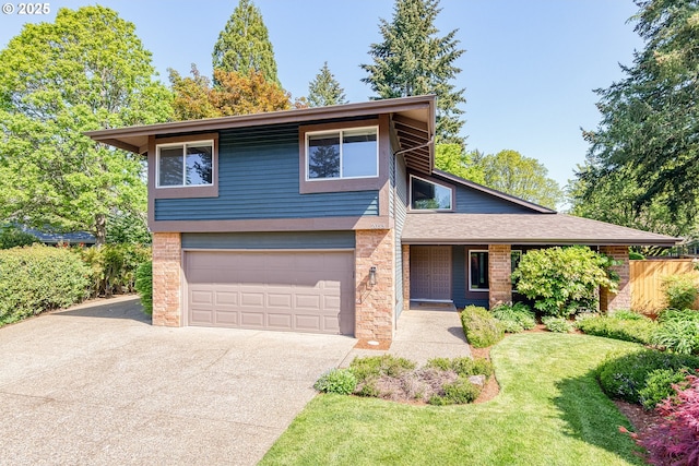 view of front of home with an attached garage, a front lawn, and aphalt driveway