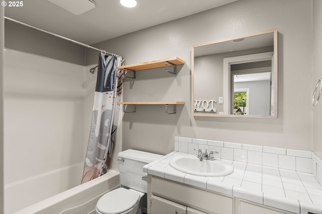 full bath with toilet, shower / bath combo, and vanity
