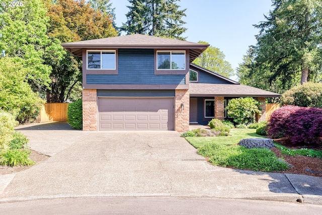 view of front of home featuring concrete driveway, an attached garage, fence, and roof with shingles