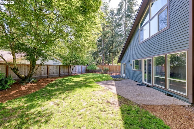 view of yard with a fenced backyard and a patio area
