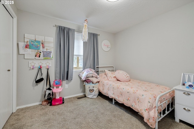 625 SE 7th Pl, Canby, OR 97013 - carpeted bedroom with a textured ceiling and baseboards