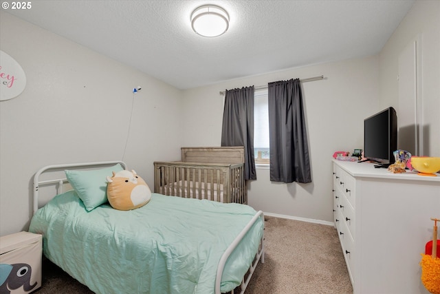625 SE 7th Pl, Canby, OR 97013 - bedroom featuring light carpet, a textured ceiling, and baseboards