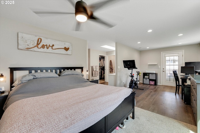 625 SE 7th Pl, Canby, OR 97013 - bedroom with wood finished floors, a spacious closet, recessed lighting, ceiling fan, and a closet