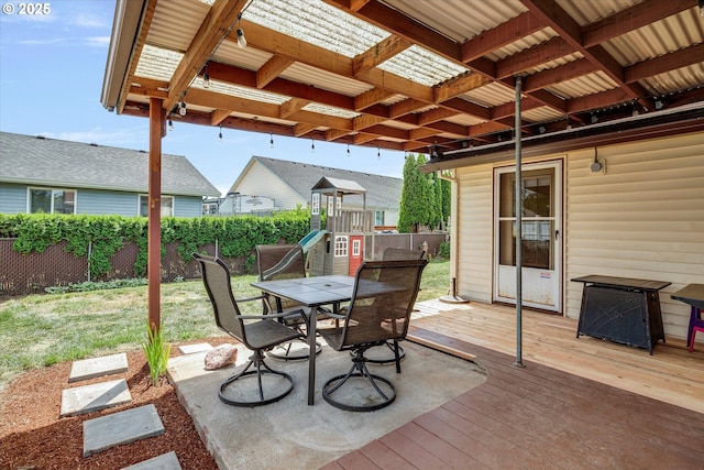 625 SE 7th Pl, Canby, OR 97013 - view of patio / terrace with a wooden deck, a playground, and outdoor dining space