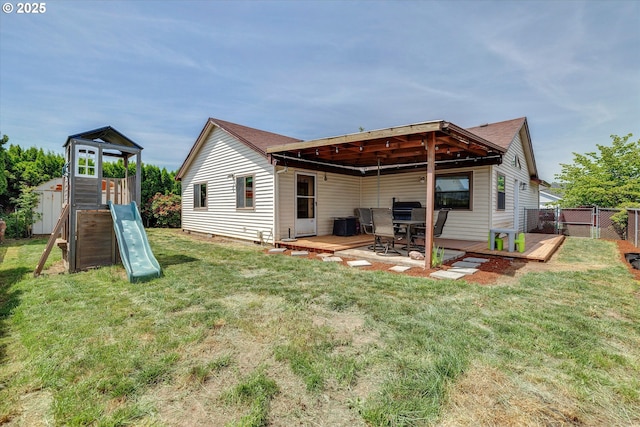 625 SE 7th Pl, Canby, OR 97013 - rear view of house featuring a playground and a deck