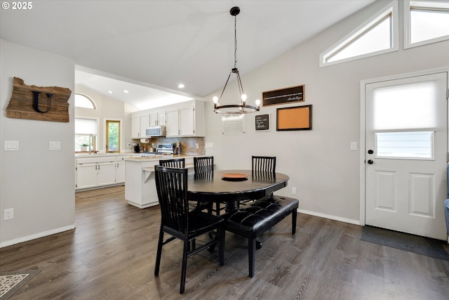 625 SE 7th Pl, Canby, OR 97013 - dining room with a chandelier, dark wood finished floors, baseboards, recessed lighting, and high vaulted ceiling