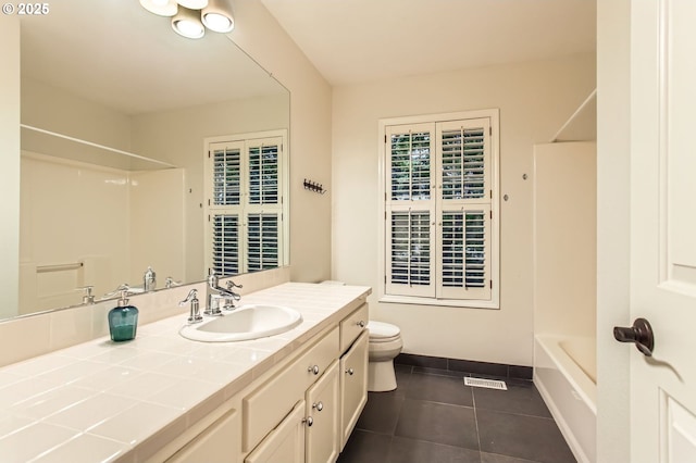 full bath featuring tile patterned flooring, vanity, toilet, baseboards, and shower / bathtub combination