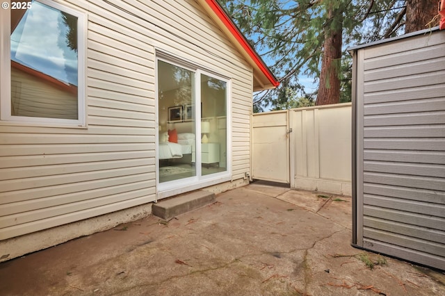 view of side of home with a patio area