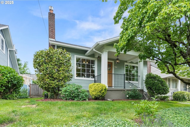 2745 NE 35th Pl, Portland, OR 97212 - view of front of home with a porch and a chimney