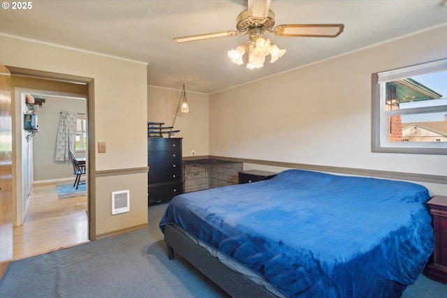 208 E 3rd St, Molalla, OR 97038 - bedroom with multiple windows, crown molding, heating unit, baseboards, and a ceiling fan