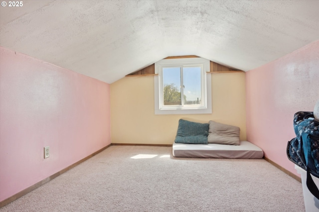 208 E 3rd St, Molalla, OR 97038 - bonus room with carpet floors, vaulted ceiling, a textured ceiling, and baseboards
