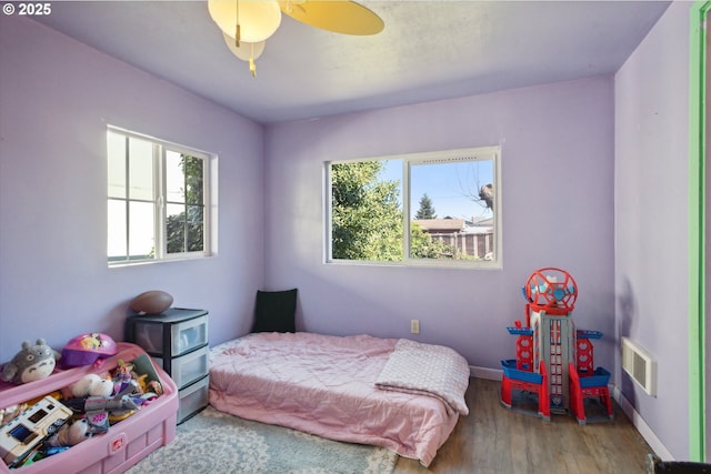 208 E 3rd St, Molalla, OR 97038 - bedroom featuring wood finished floors, baseboards, and a ceiling fan
