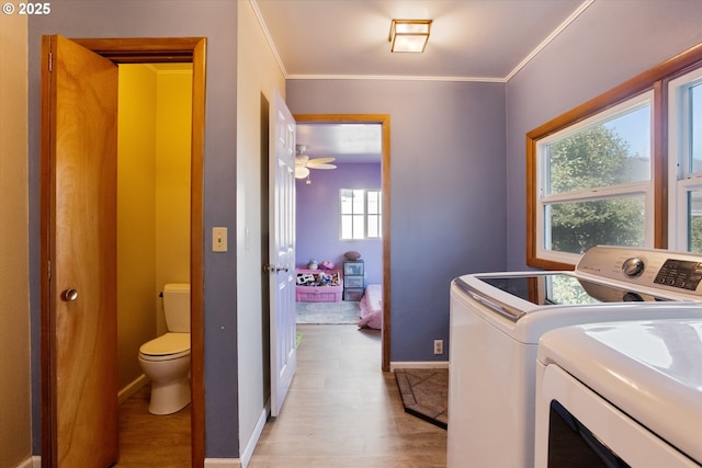208 E 3rd St, Molalla, OR 97038 - laundry area featuring light wood-type flooring, independent washer and dryer, baseboards, and crown molding