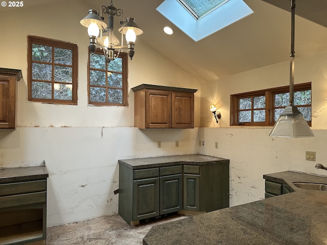 kitchen featuring lofted ceiling, decorative light fixtures, a chandelier, a sink, and recessed lighting