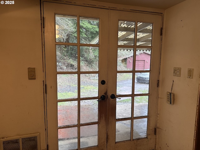 entryway featuring visible vents and french doors